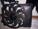 1989 Chevrolet Blazer - Radiator fan assembly part shown on carpet with some papers nearby.
