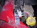 1989 Chevrolet Blazer - Close-up of engine bay components including a relay, wiring, and a yellow washer fluid cap.
