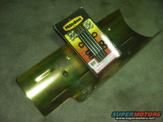 Yellowish metal engine part with a Milodon brand hardware kit on top
