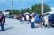 2006 Ford Mustang - People gather around parked cars with hoods up at an outdoor event.