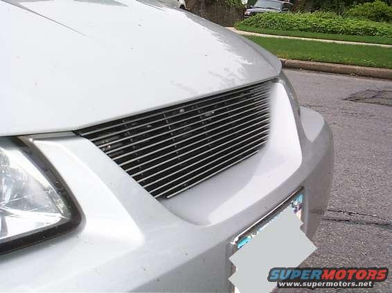 White car with custom horizontal grille and headlight