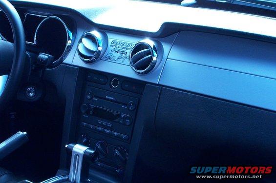 Interior shot of a 2006 Ford Mustang, showing the dashboard, air vents, and center console