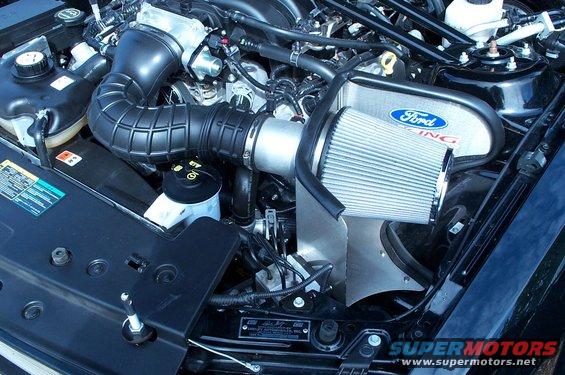 Ford Racing air intake system on a dark-colored engine bay, likely a 2005-2010 Mustang