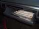 1971 Ford Ranchero - The interior of a vehicle shows an open glove compartment stuffed with documents.
