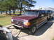 1988 Ford C-350 (Centurion Conversions) - Maroon Ford F-Series SUV towing a trailer on a paved surface.