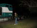 1988 Ford C-350 (Centurion Conversions) - A person stands next to a semi-truck cab and chassis at night, appearing distressed.