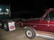 1988 Ford C-350 (Centurion Conversions) - Maroon Ford F-250 truck is seen from the side, towing a semi-trailer at night.