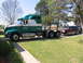 1988 Ford C-350 (Centurion Conversions) - Semi-truck towing a van and another vehicle on a sunny day.