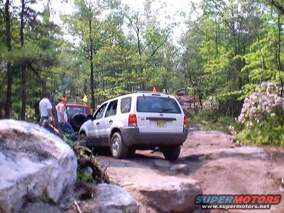 White 2001 Ford Escape on a rocky trail