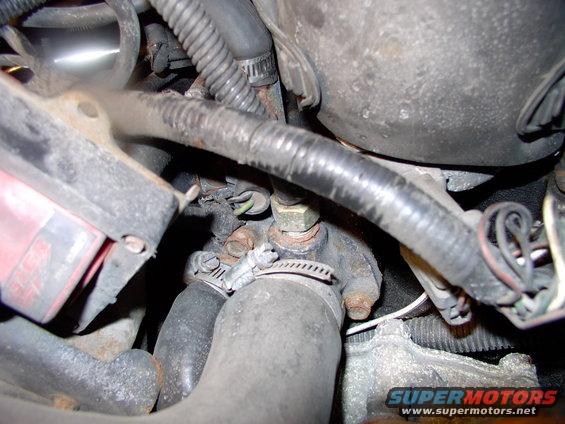 Two half inch bolts that couldn't be more poorly located for access, removability or for re-installation.