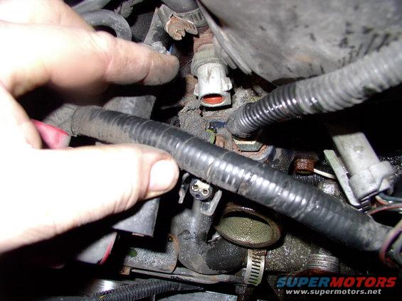 Pull off the coolant temp sensor plug for better access as well. I had to clock mine slightly different from stock to allow the extra temp sensor into the aftermarket T-stat housing (it's for my Taurus electric fan).