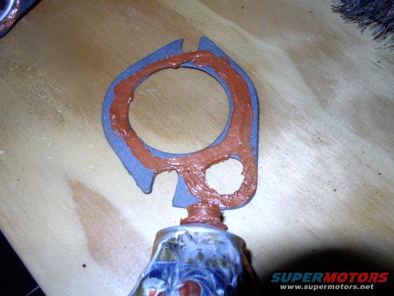 On goes more sealant onto the gasket.