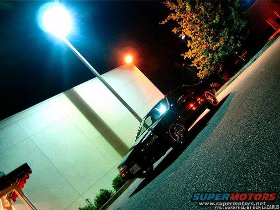 1997 Ford Thunderbird parked at night under a street light