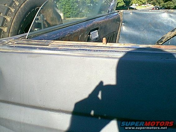 top-off.jpg you can see the glass goes down in the gate.Tip do not roll up and drive without the frame support the glass will break.