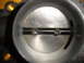 1993 Mazda MX-3 - This is a close-up view of a throttle body, a component of the engine's air intake system.