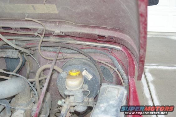 1998 Jeep TJ engine bay showing brake booster and master cylinder