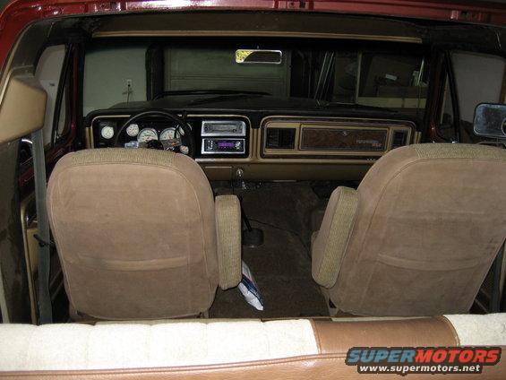 1979 Ford Bronco interior with brown seats and wood-grain trim