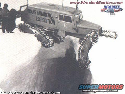 tracked vehicle with "TRANS ANTARCTIC EXPEDITION" text on side, traversing snow