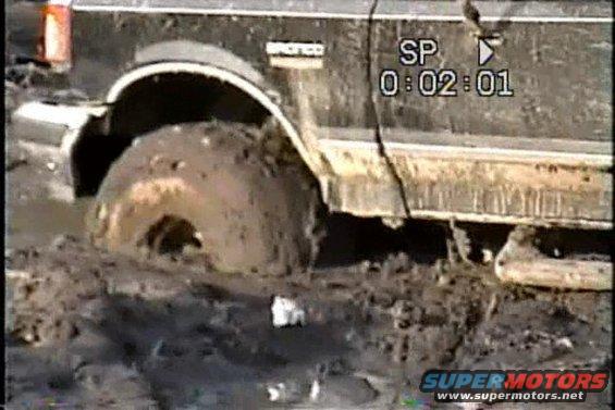 nc-stuck-in-mud-half-way-up-tire.jpg front tire gummed up! not spinning at all! four wheel drive not engaging! ! !