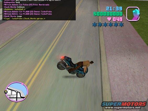 Motorcycle doing a wheelie on a road, with game UI elements visible