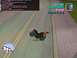 1990 Ford Probe - A video game screenshot shows a motorcycle performing a wheelie on a street, complete with in-game statistics.
