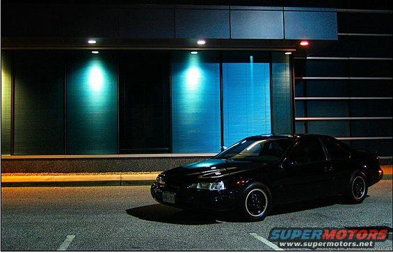 Black 1997 Ford Thunderbird parked at night
