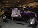 1993 Ford Taurus - Custom hot rod on display, custom paint and interior, with hood and doors open.