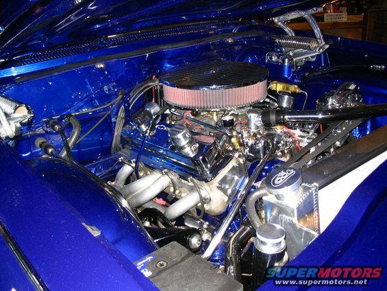 Blue engine bay with chrome details and aftermarket air filter
