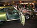 1993 Ford Taurus - This custom green muscle car features a prominent engine and detailed interior, with 'GTX' badging visible on the side.
