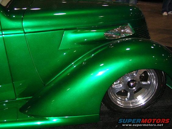 Green hot rod fender and chrome wheel