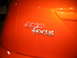 1993 Ford Taurus - The chrome SHO Focus badge is visible on the orange car's body panel.