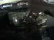 1993 Ford Taurus - A close-up view of a car's engine bay, shiny components and some visible text.