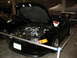 1993 Ford Taurus - A black coupe is displayed with its hood open, revealing a detailed engine bay and chrome wheels.