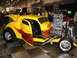 1993 Ford Taurus - Custom hot rod with exposed engine and flame graphics on doors at a show.
