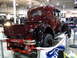 1993 Ford Taurus - Antique pickup truck displayed indoors with a Ford banner in the foreground.