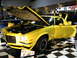 1993 Ford Taurus - This bright yellow 1970 Chevrolet Camaro Z28 is displayed with its hood and door open, revealing the engine bay.