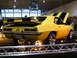 1993 Ford Taurus - A bright yellow 1969 Chevrolet Camaro Z/28 is displayed indoors with its hood open and black racing stripes.