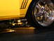 1993 Ford Taurus - A yellow car is shown with custom suspension and large chrome wheels, with "SUPERMOTORS.NET" visible at the bottom right.