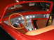 1993 Ford Taurus - Interior view of a custom hot rod a wood-rimmed steering wheel and a dashboard with multiple chrome gauges.