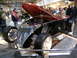 1993 Ford Taurus - Custom hot rod displayed at an indoor event, showing off its engine and unique grille design.