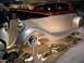 1993 Ford Taurus - Custom hot rod on display at an auto show, a two-tone paint scheme and polished metal accents.