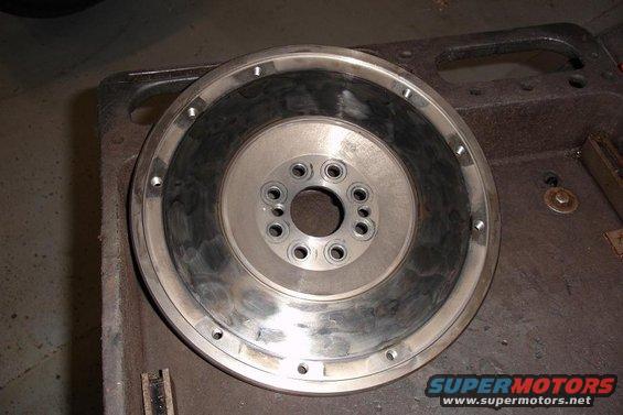 Clutch side of flywheel showing damage to friction surface.