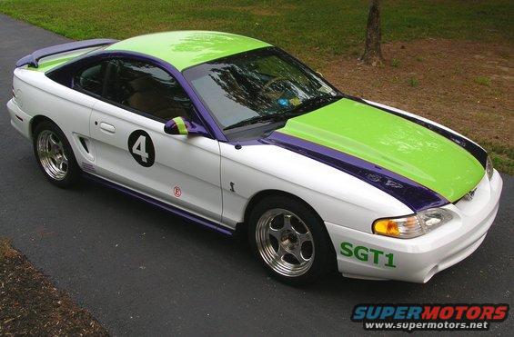 1995 Ford Mustang with white, green, and purple racing livery, number 4 on door, SGT1 on fender