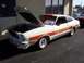 2002 Ford Mustang - This 1976 Ford Mustang Cobra II is displayed with its hood open, showing off its engine bay.
