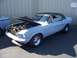 2002 Ford Mustang - This 1967 Ford Mustang coupe is being displayed with its hood open, revealing the engine bay.