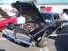 2002 Ford Mustang - This black 1969 Mercury Cougar is displayed with its hood open, revealing the engine bay.