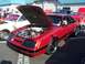 2002 Ford Mustang - Red Ford Mustang from the mid-1980s is displayed with its hood open.