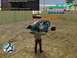 1990 Ford Probe - A virtual car is heavily damaged in a video game scene, with a character standing nearby.