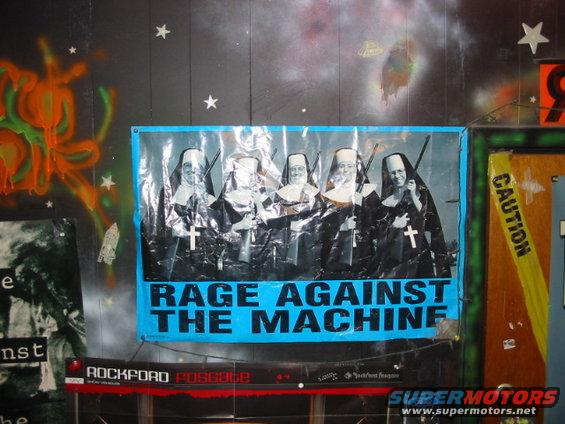 Poster of nuns holding guns with 'Rage Against the Machine' text