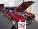 2002 Ford Mustang - A classic Mustang Mach 1 is displayed with its hood open, revealing the engine bay.